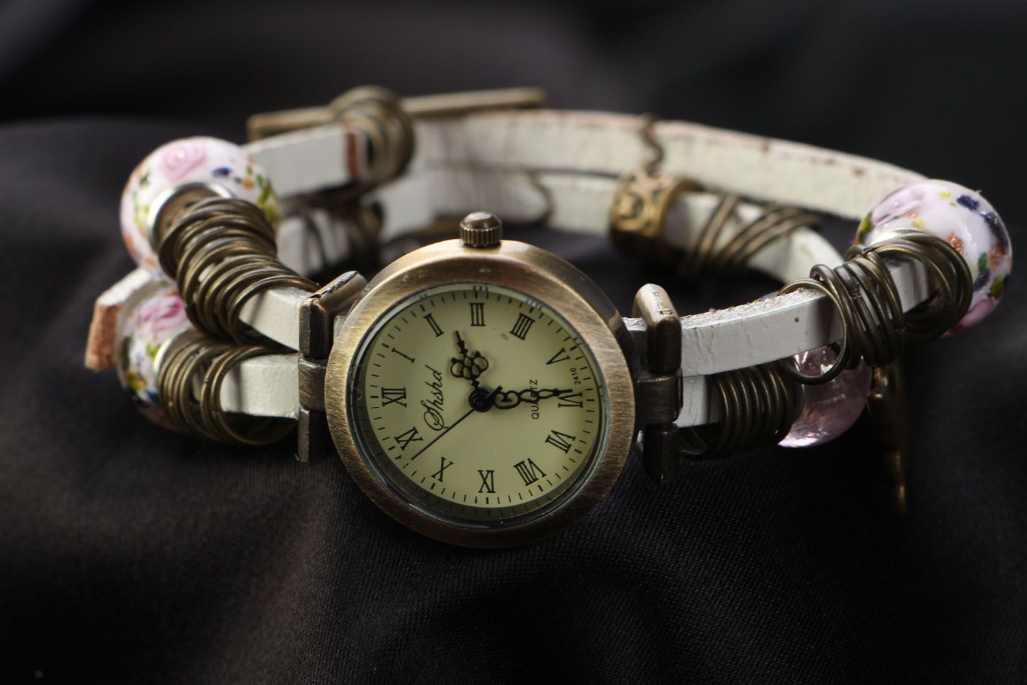 Unusual watch with charms photo 2