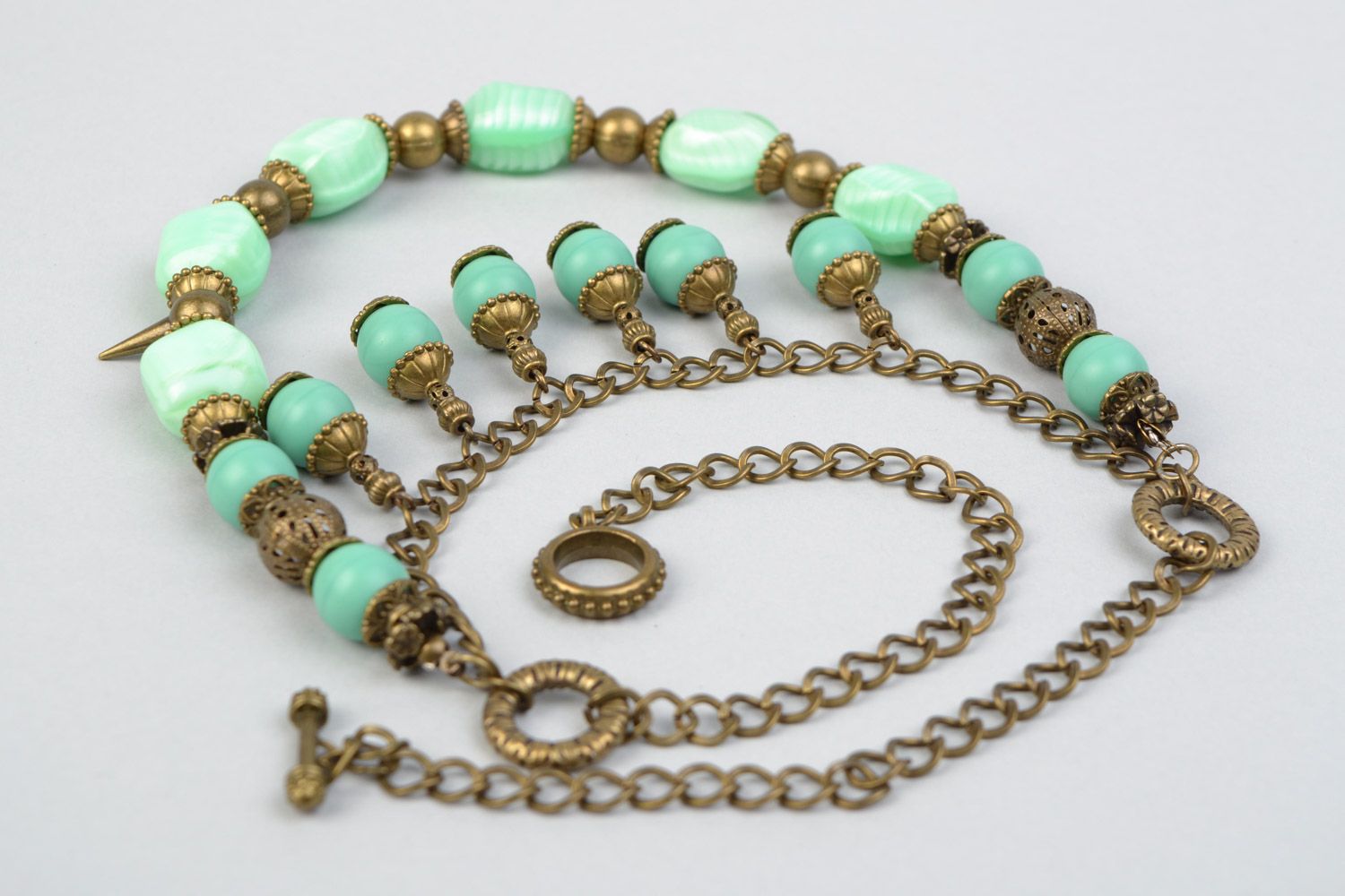 Handmade multi row necklace with glass beads of mint color and metal prickles  photo 4