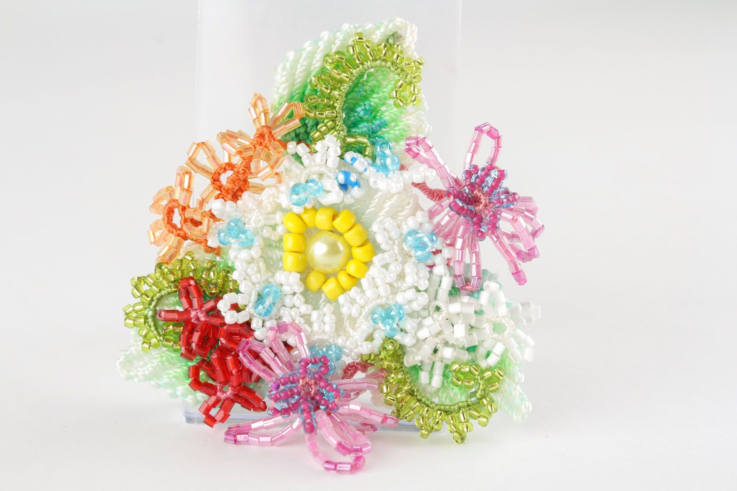 Brooch made of threads and beads photo 2