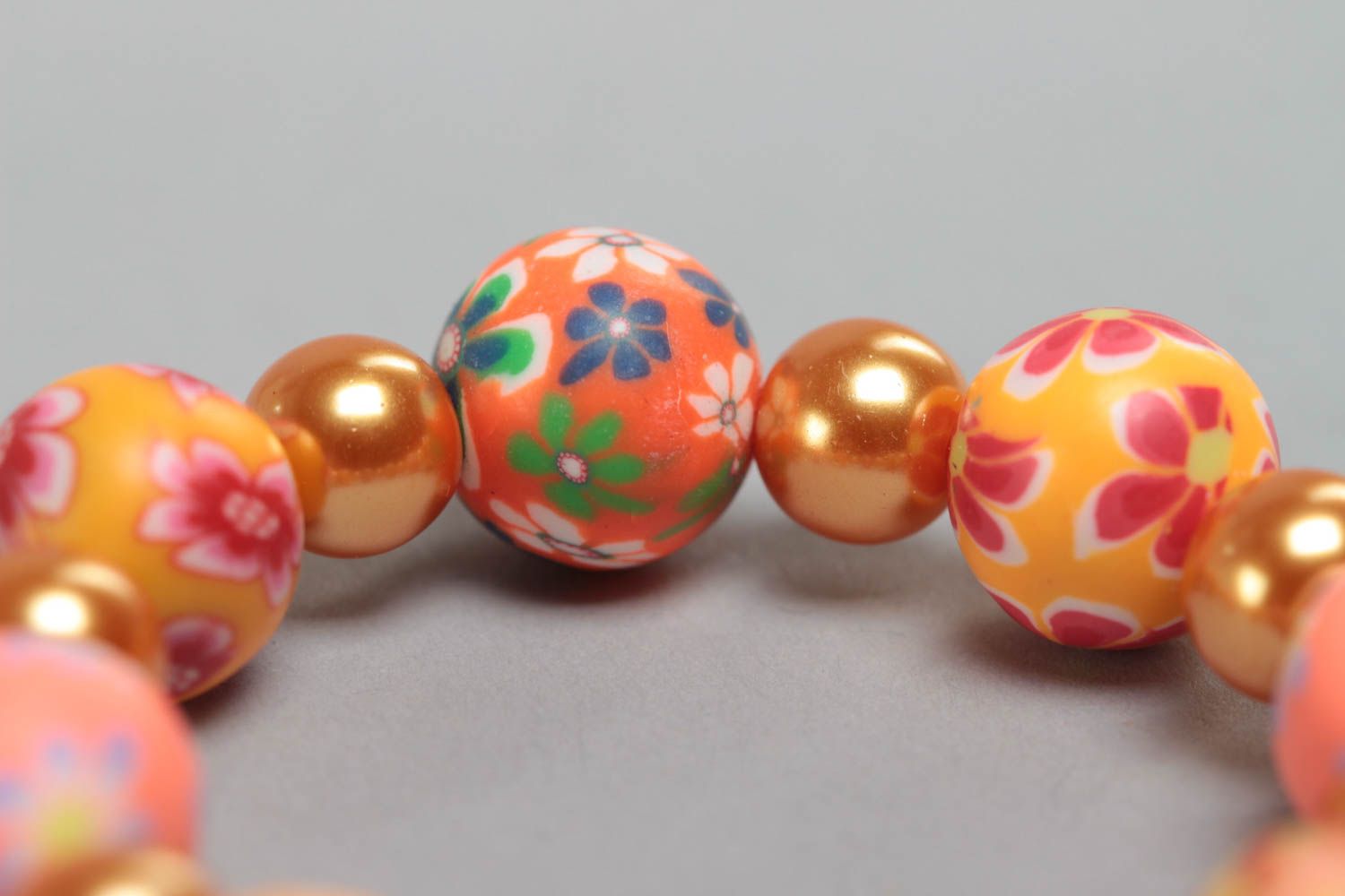 Orange handmade children's bracelet created of polymer clay and ceramic beads photo 3