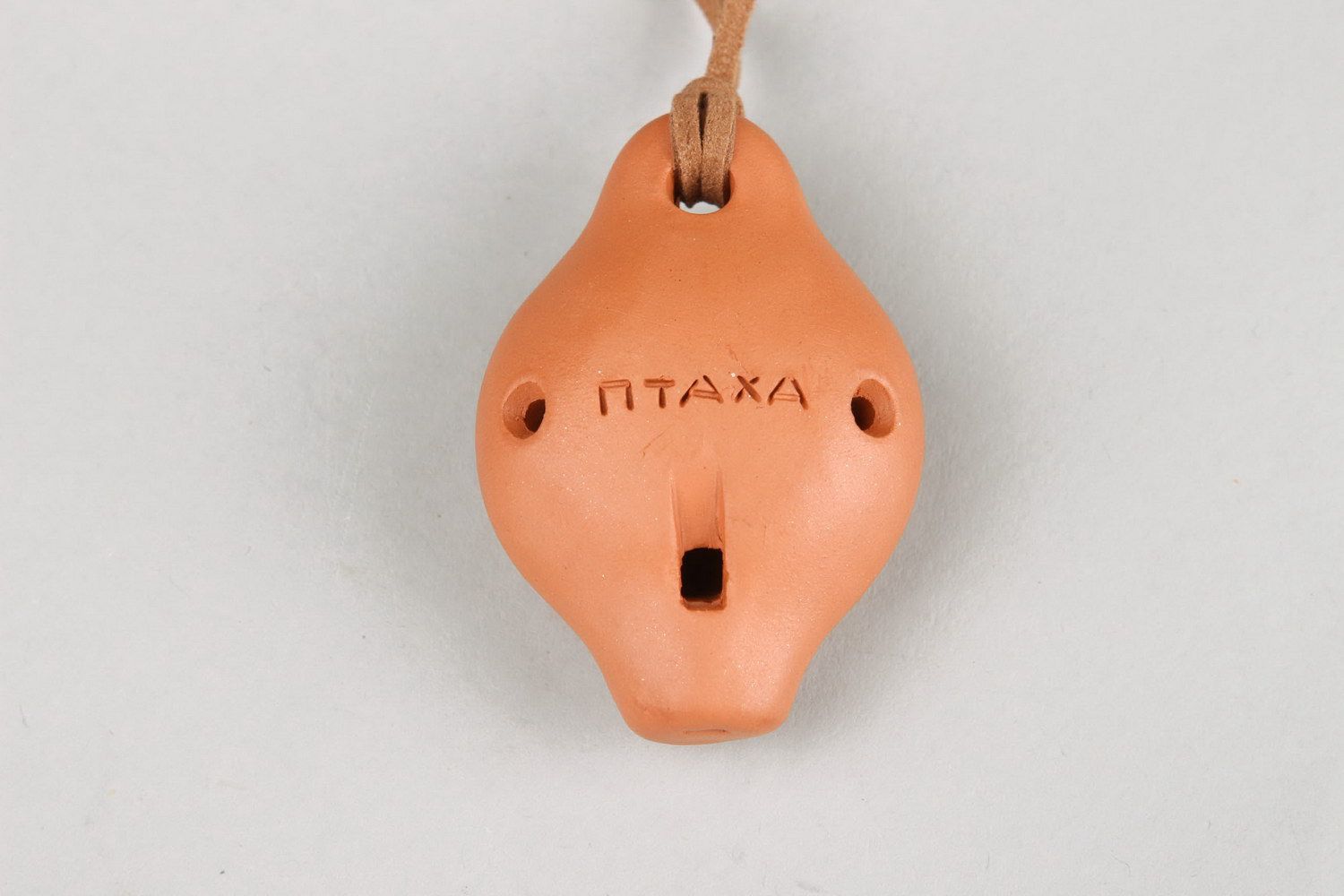 Ceramic tin whistle pendant with embossment photo 4