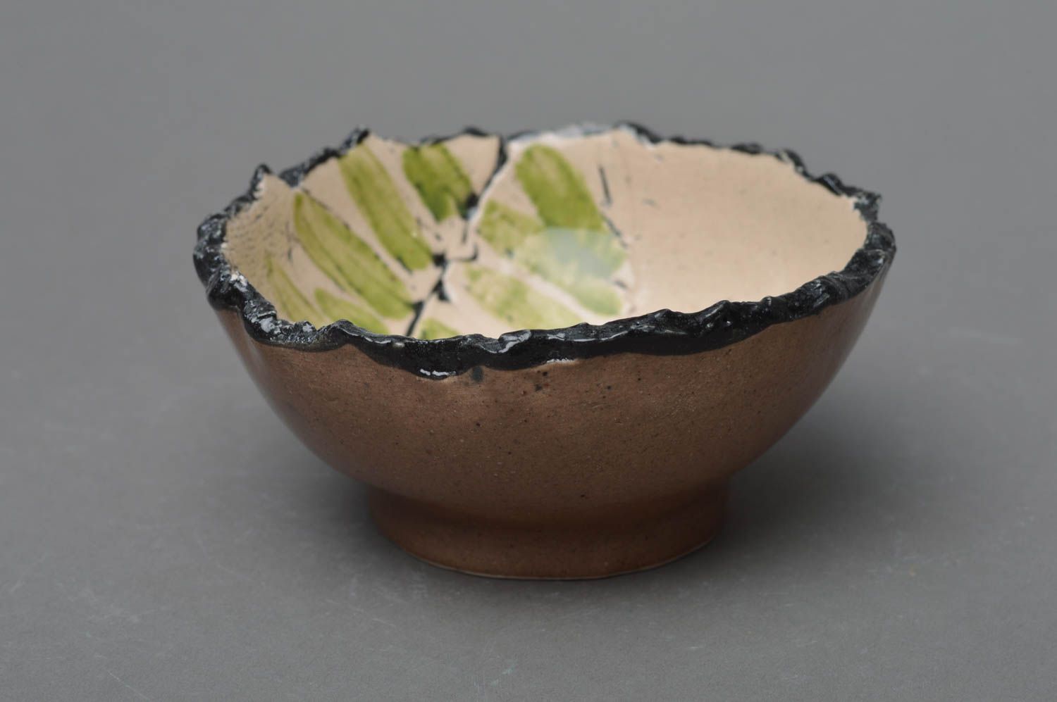 Handmade small light porcelain glazed bowl with dark ragged edges photo 1