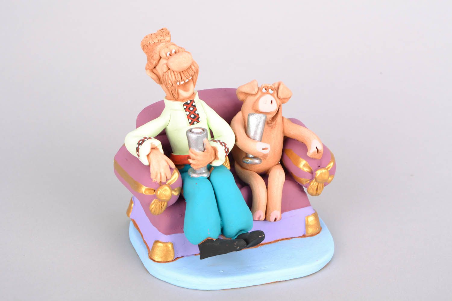 Ceramic figurine Cossack on a sofa photo 3