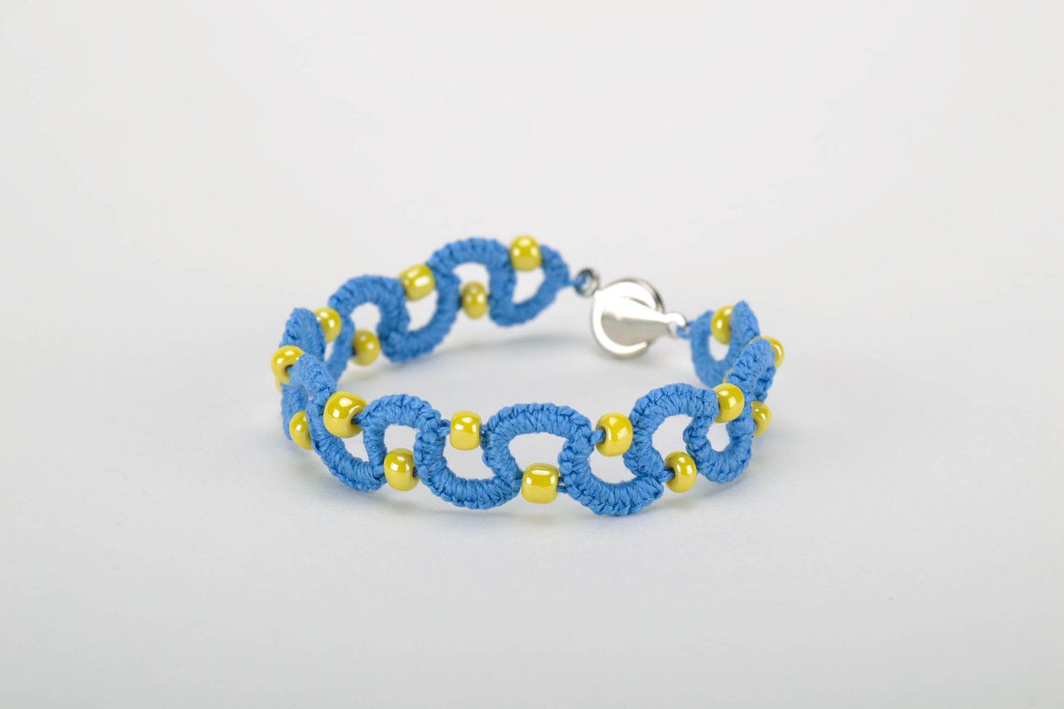 Blue bracelet woven from threads photo 3