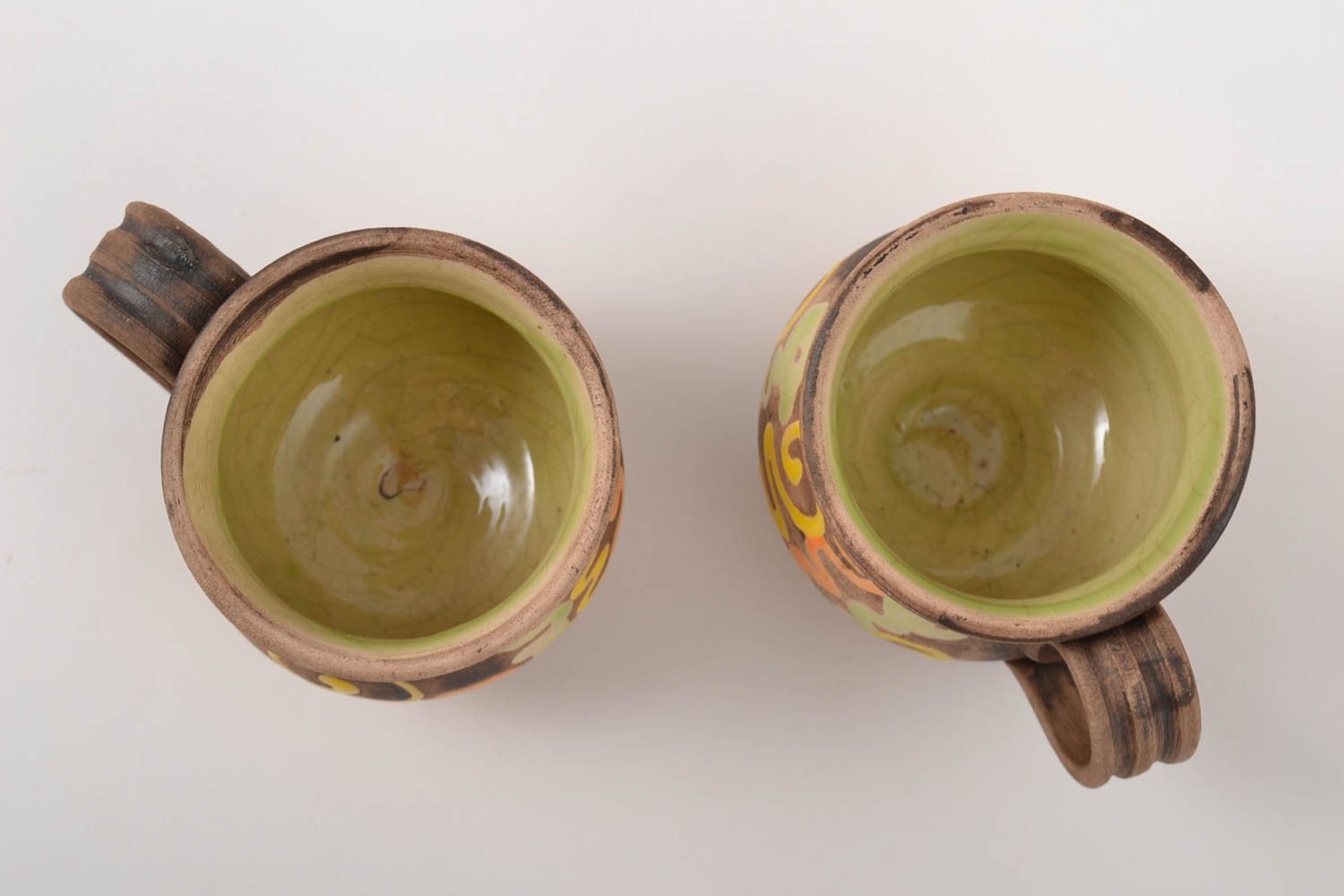 Set of 2two ceramic clay cups with light green glaze inside with handle and hand-painted pattern photo 2