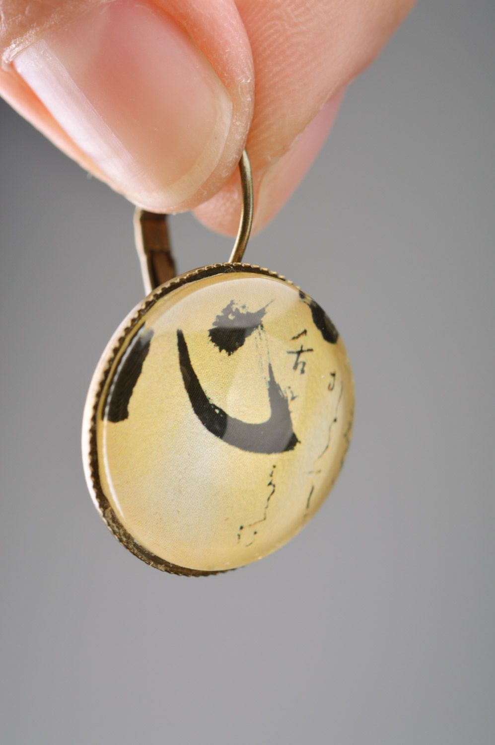 Handmade designer metal dangle earrings of round shape with print Hieroglyphs   photo 3