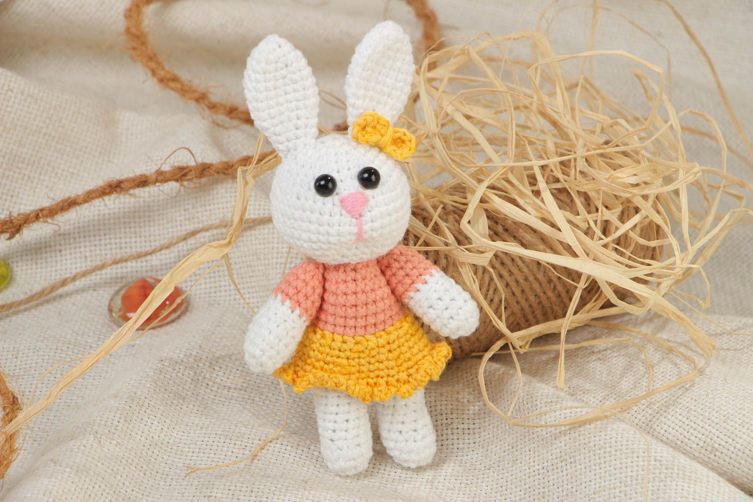 Handmade soft knitted white girl-rabbit toy in a dress for children photo 1