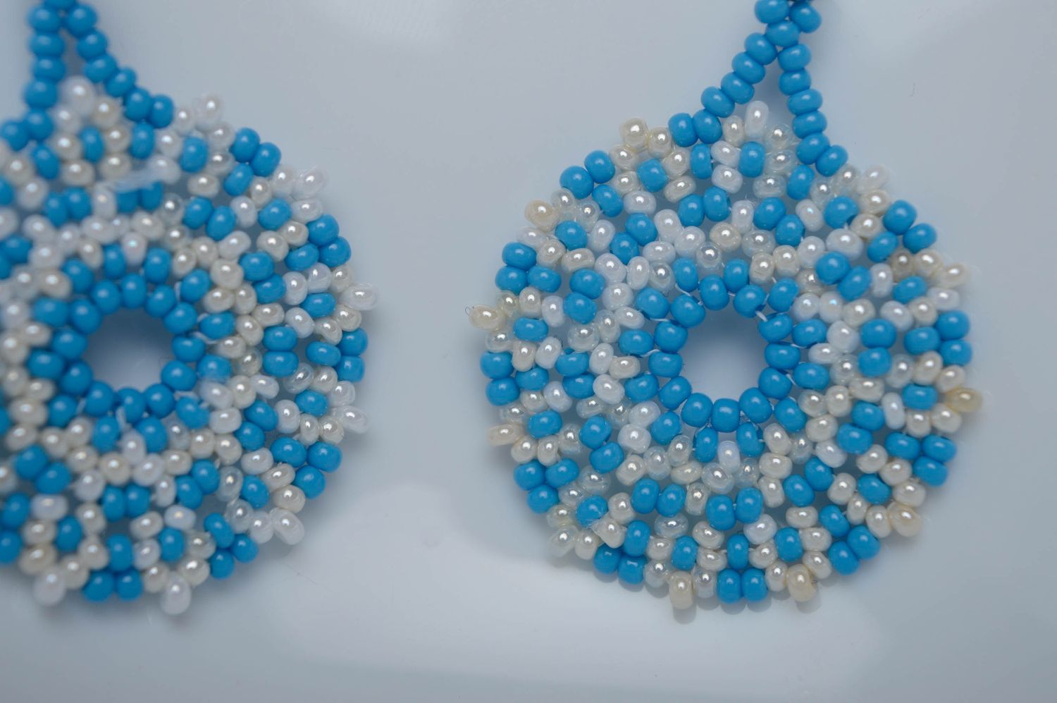 White and blue beaded earrings photo 2