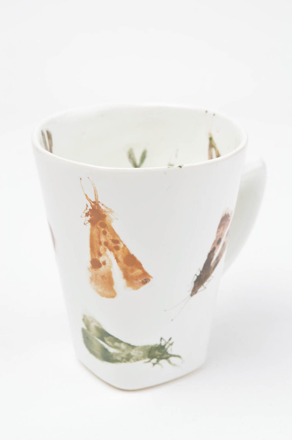White ceramic teacup with handle and insects prints photo 3