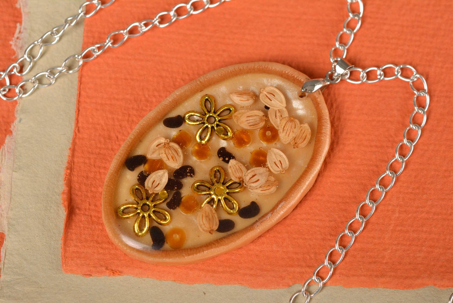 Handmade designer oval pendant on polymer clay basis with epoxy resin on chain photo 1