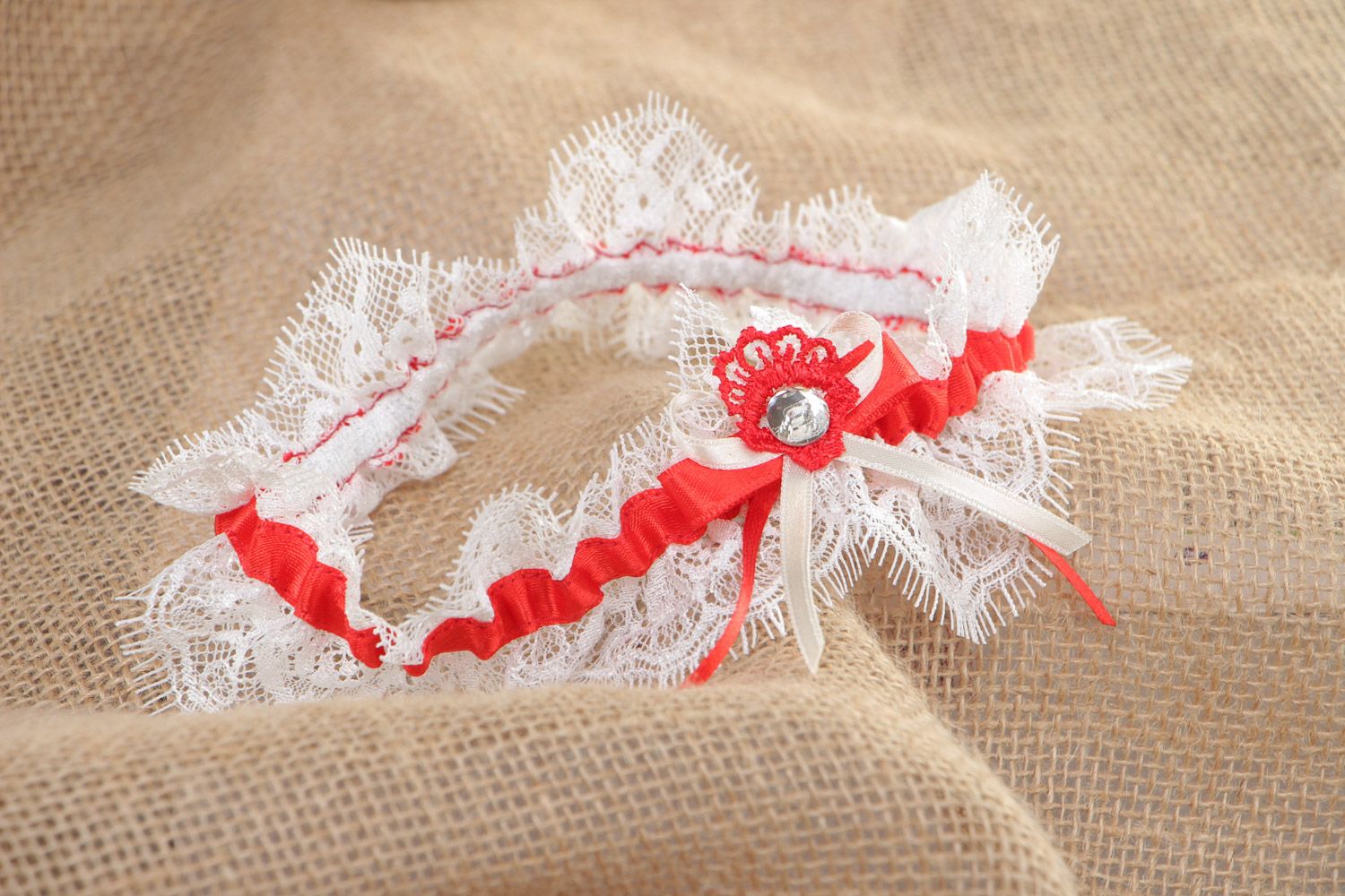 Handmade white wedding bridal garter with French lace and red satin ribbon photo 1