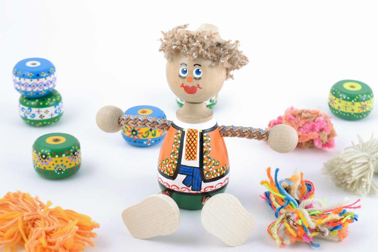 Wooden handmade decorative toy boy in ethnic attire eco-friendly toys for children photo 1