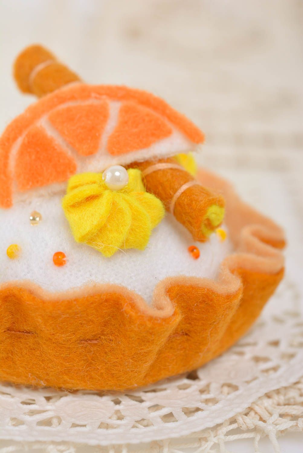 Handmade designer decorative soft pincushion sewn of felt bright orange cake photo 4