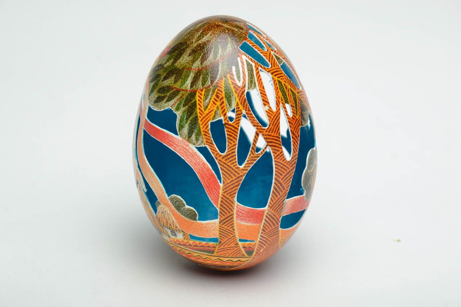 Easter egg painted with aniline dyes and decorated using carving technique photo 3
