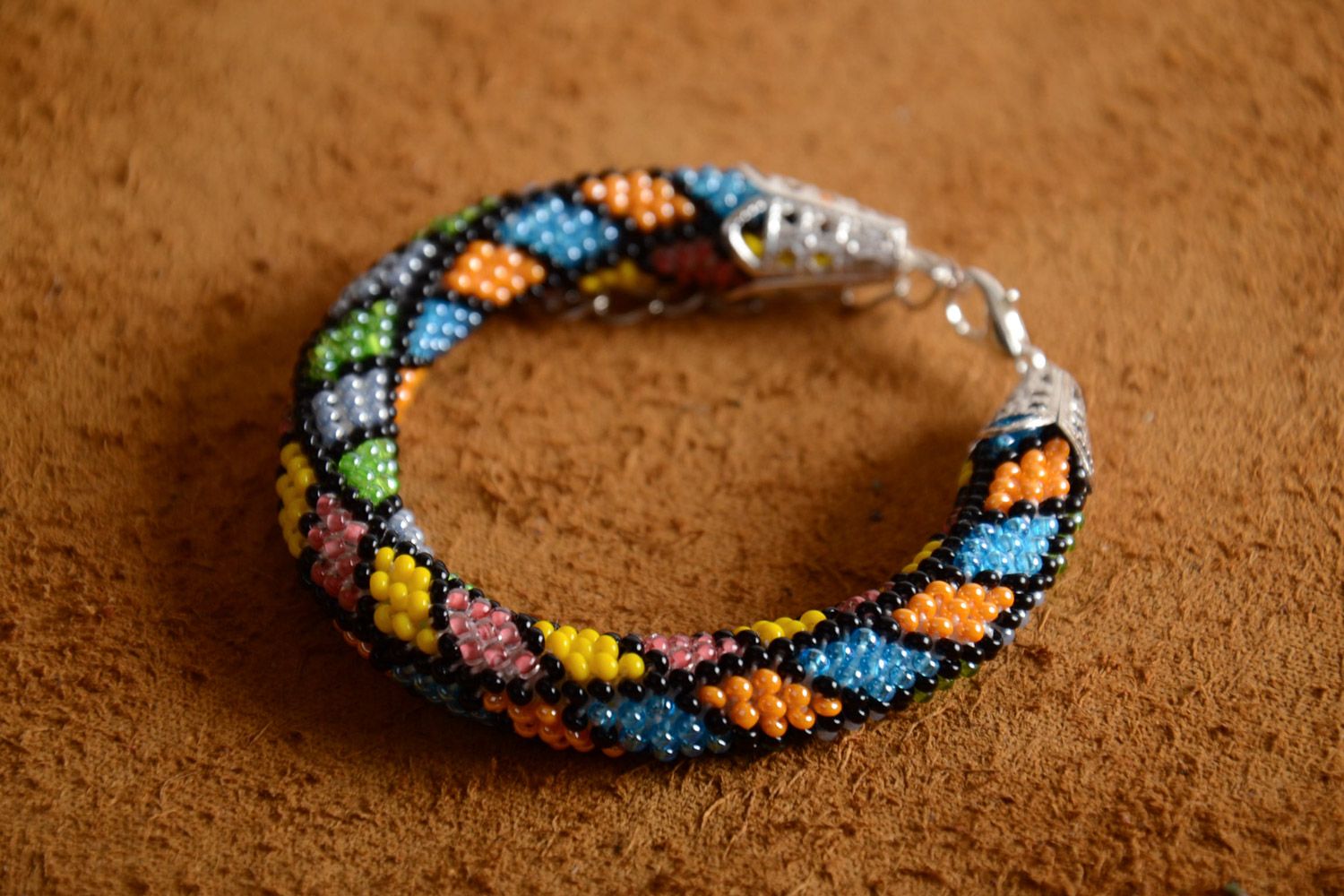 Handmade bright beaded cord bracelet for women in black, yellow, blue, and orange colors  photo 1