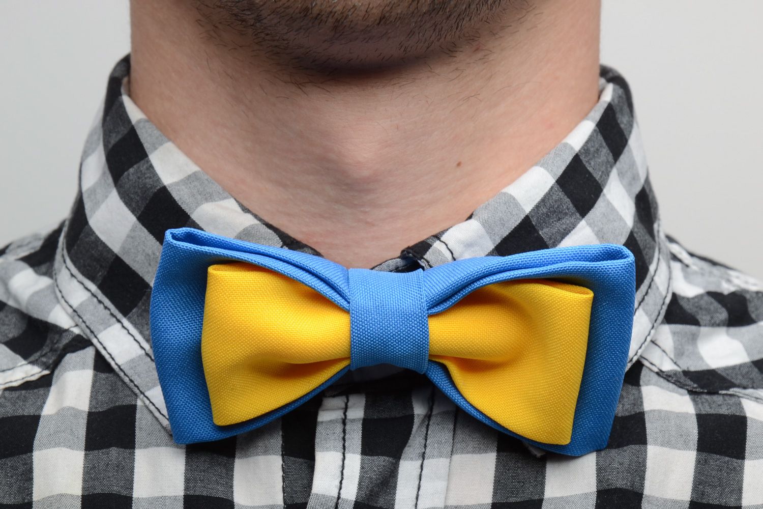 Handmade bow tie sewn of costume fabric in contrast combination of blue and yellow photo 1