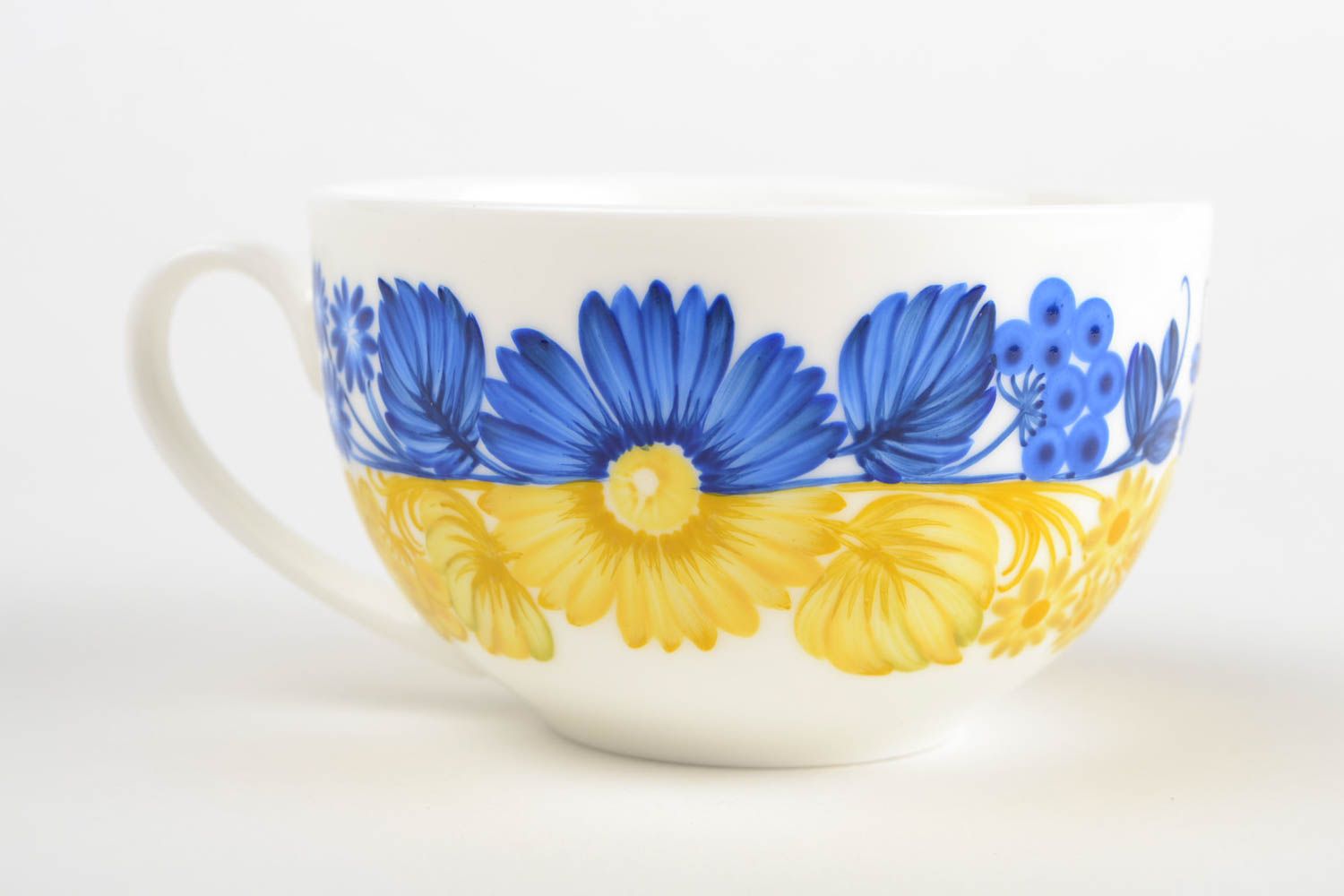 White wide ceramic porcelain cup in blue and yellow color with handle photo 3