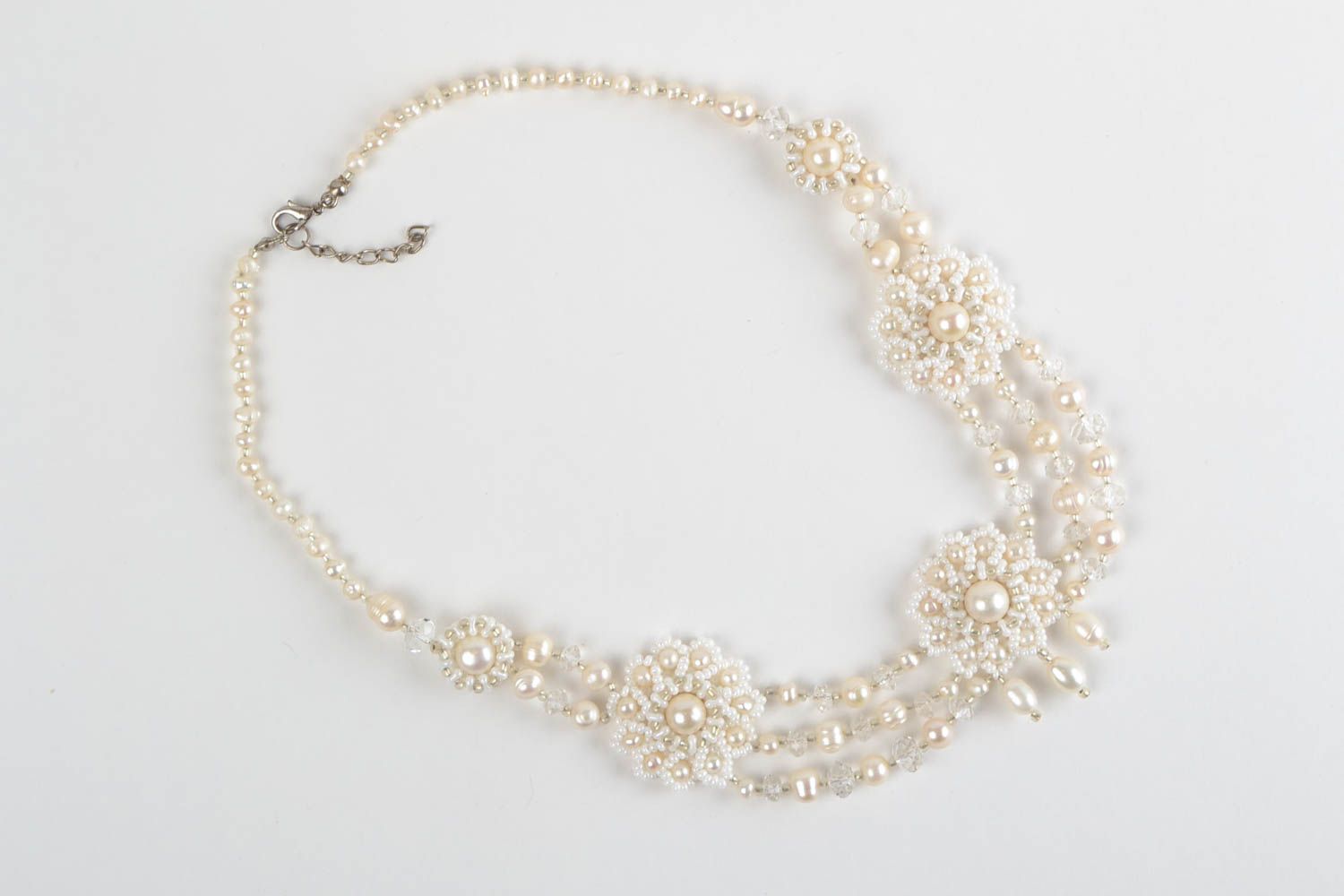 Beautiful festive handmade white necklace made of beads and natural stones photo 2