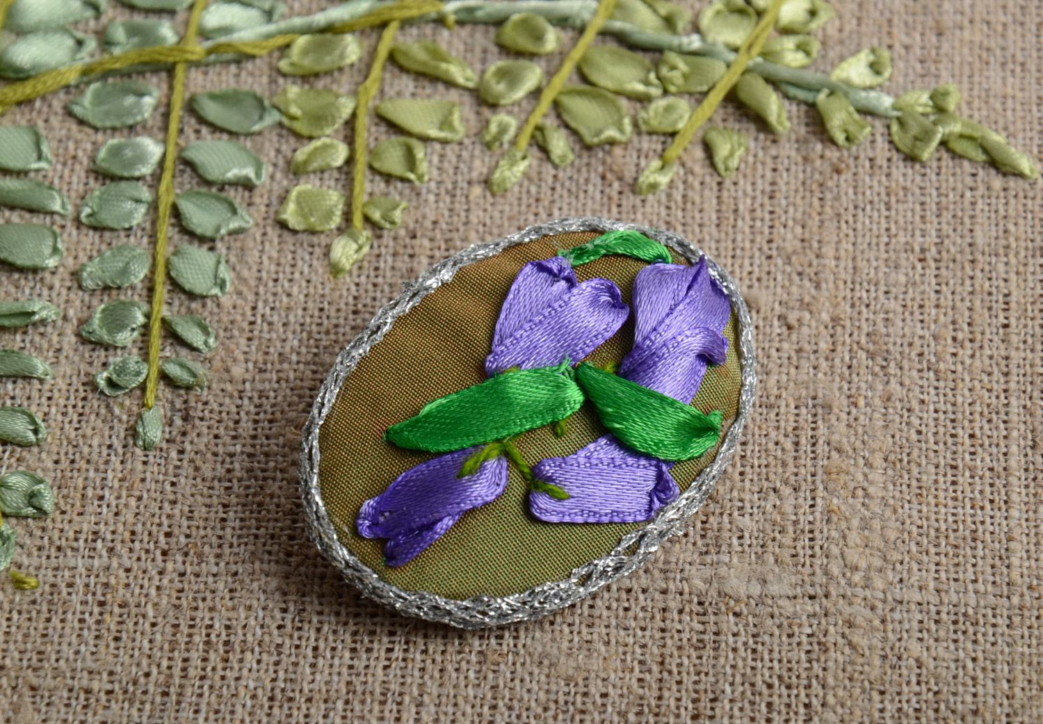 Handmade textile brooch with blue flowers embroidered using satin ribbons photo 1