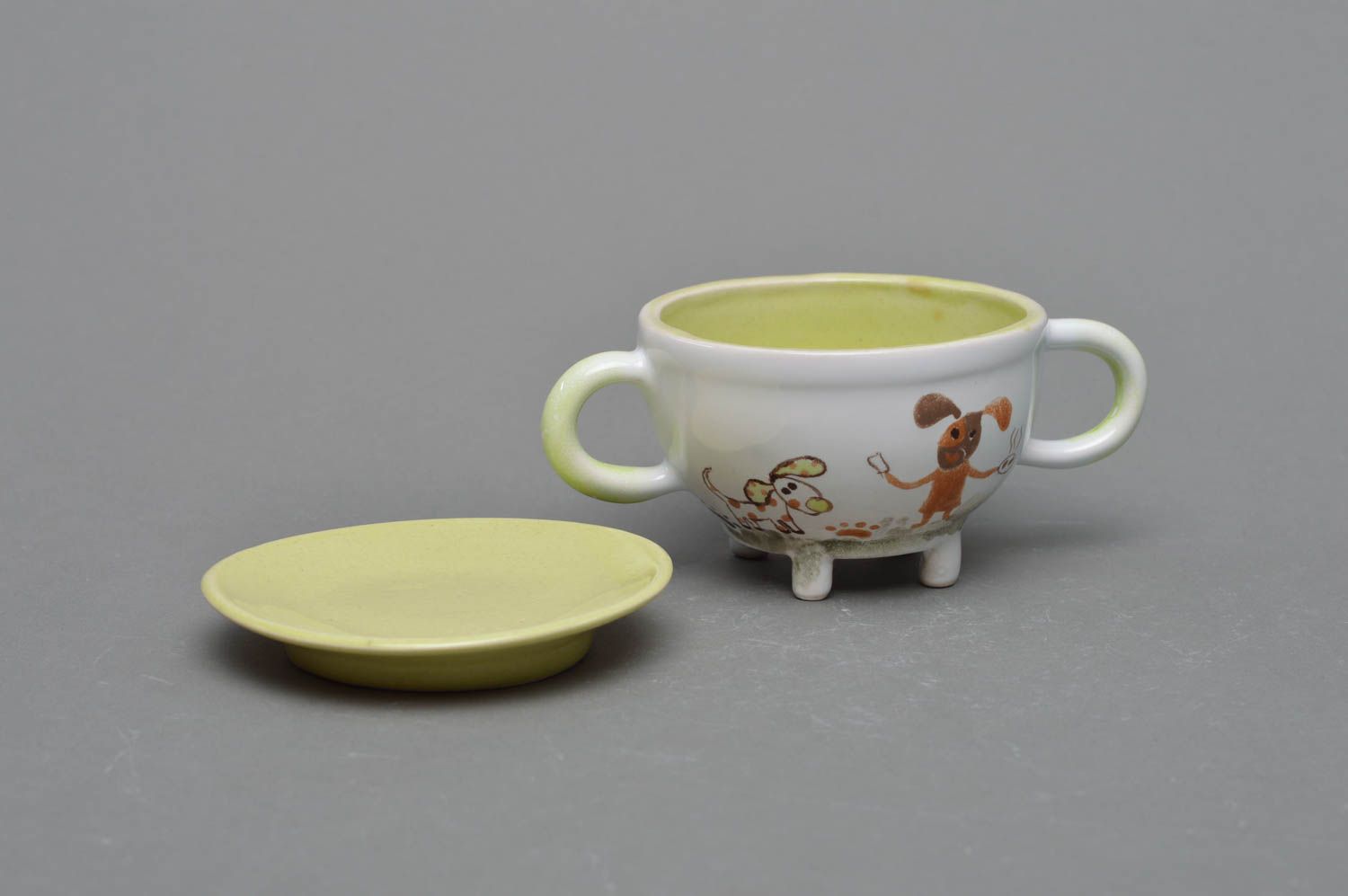 Handmade porcelain 5 oz kid drinking cup with two handles, legs, and a saucer photo 2