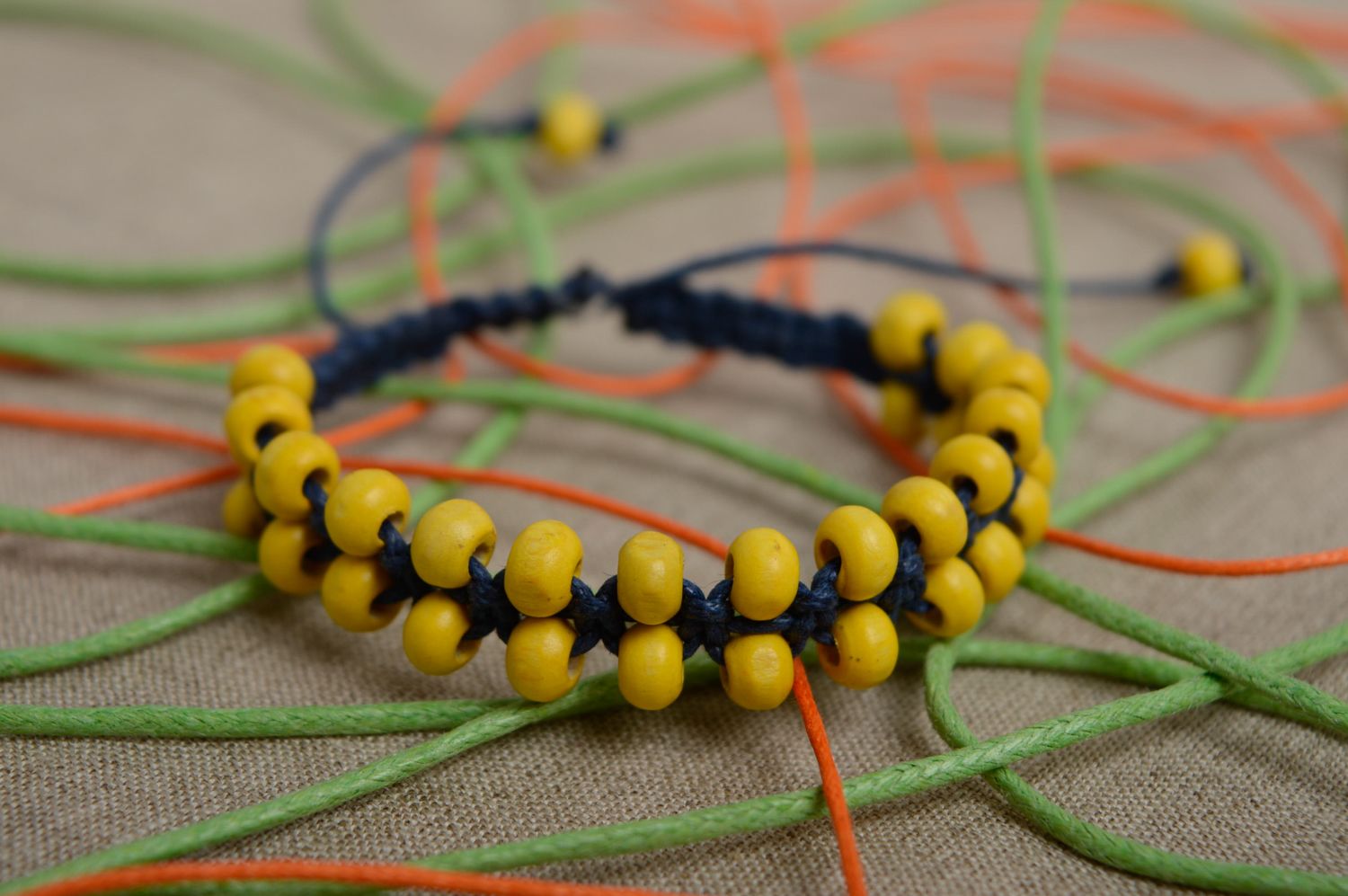 Two-row macrame bracelet made of waxed cord and wooden beads photo 2