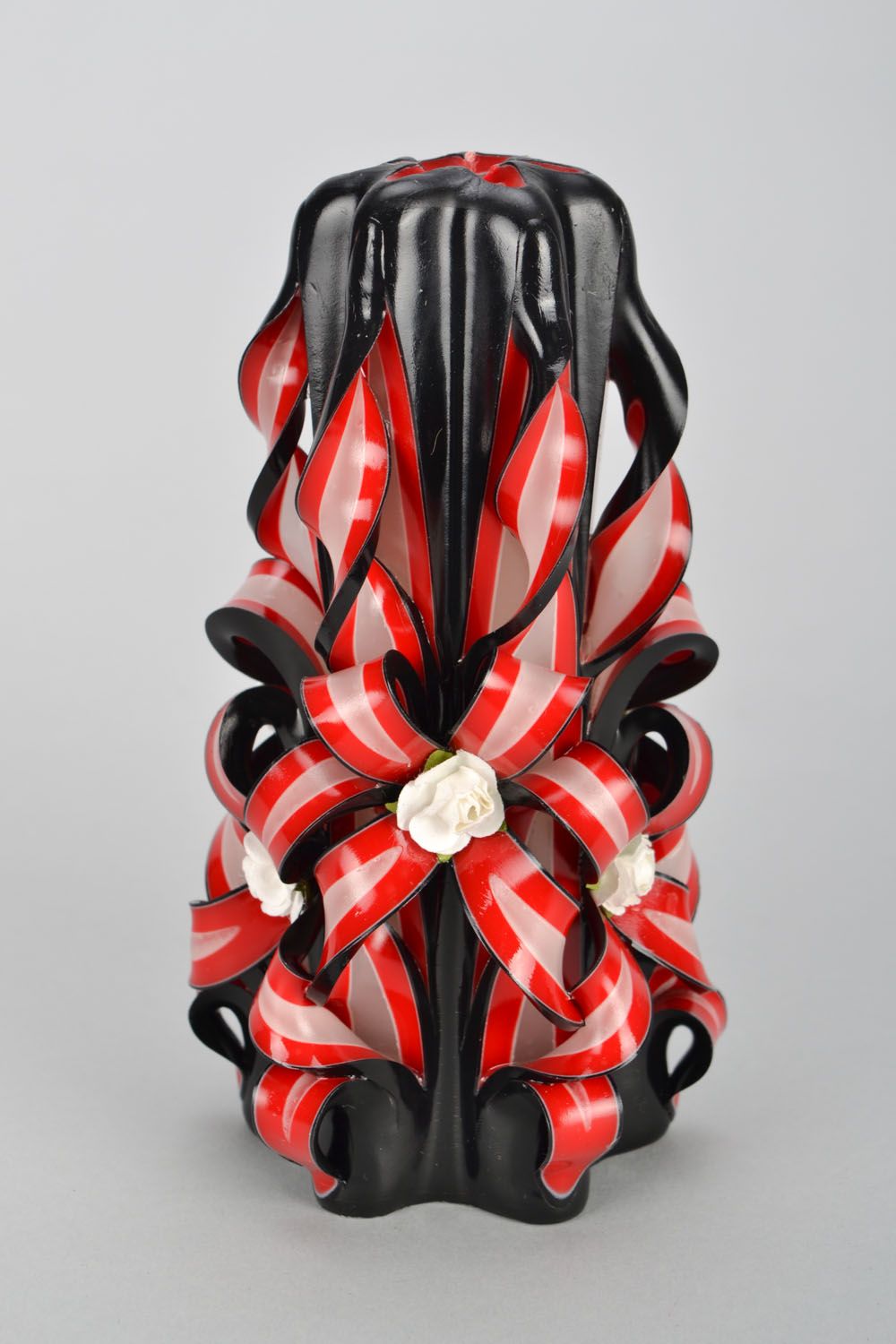 Black and red carved candle photo 4