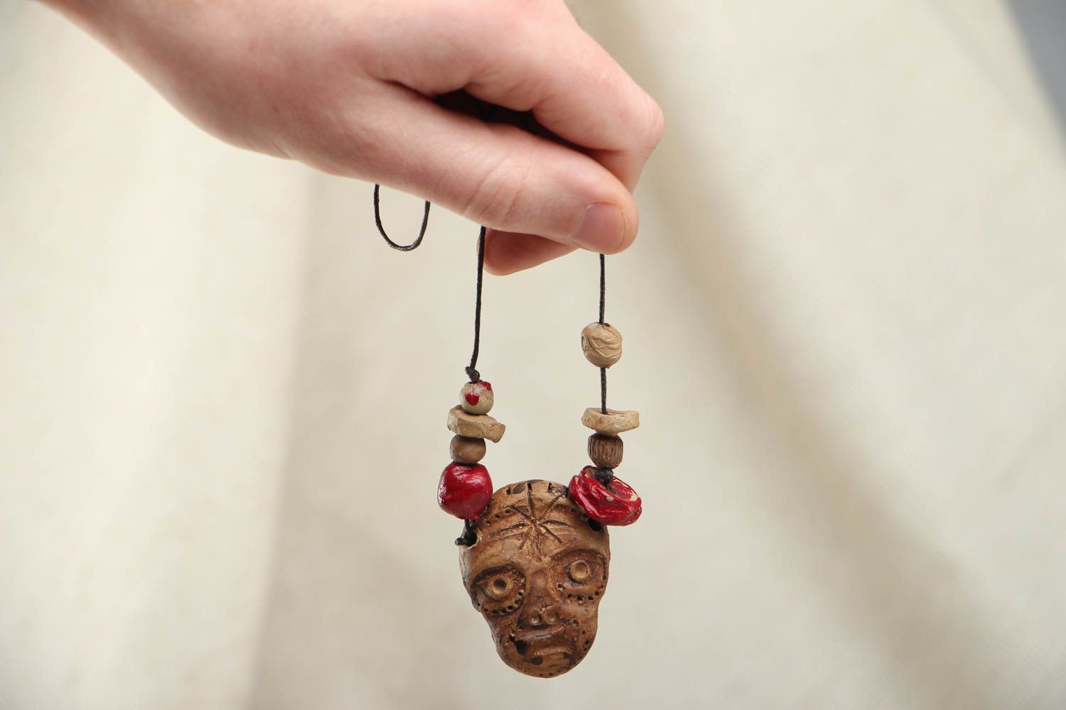 Ceramic pendant in the shape of mask photo 4