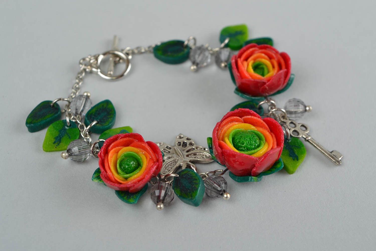 Beautiful women's handmade designer wrist bracelet with plastic flowers photo 1