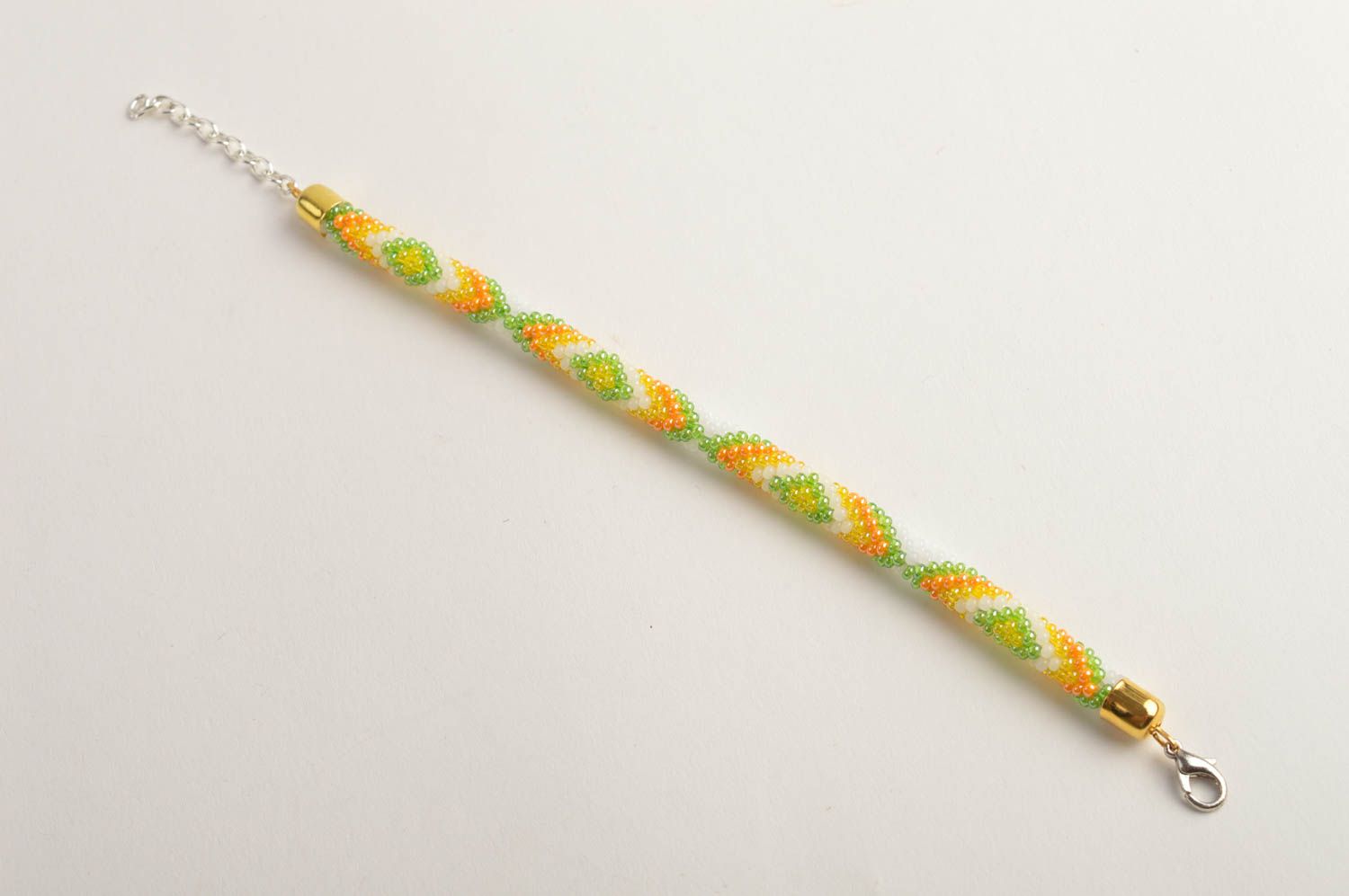 Beaded cord adjustable bracelet in light green, yellow and white color photo 2