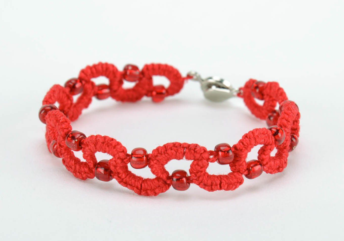 Red bracelet made from cotton threads photo 1