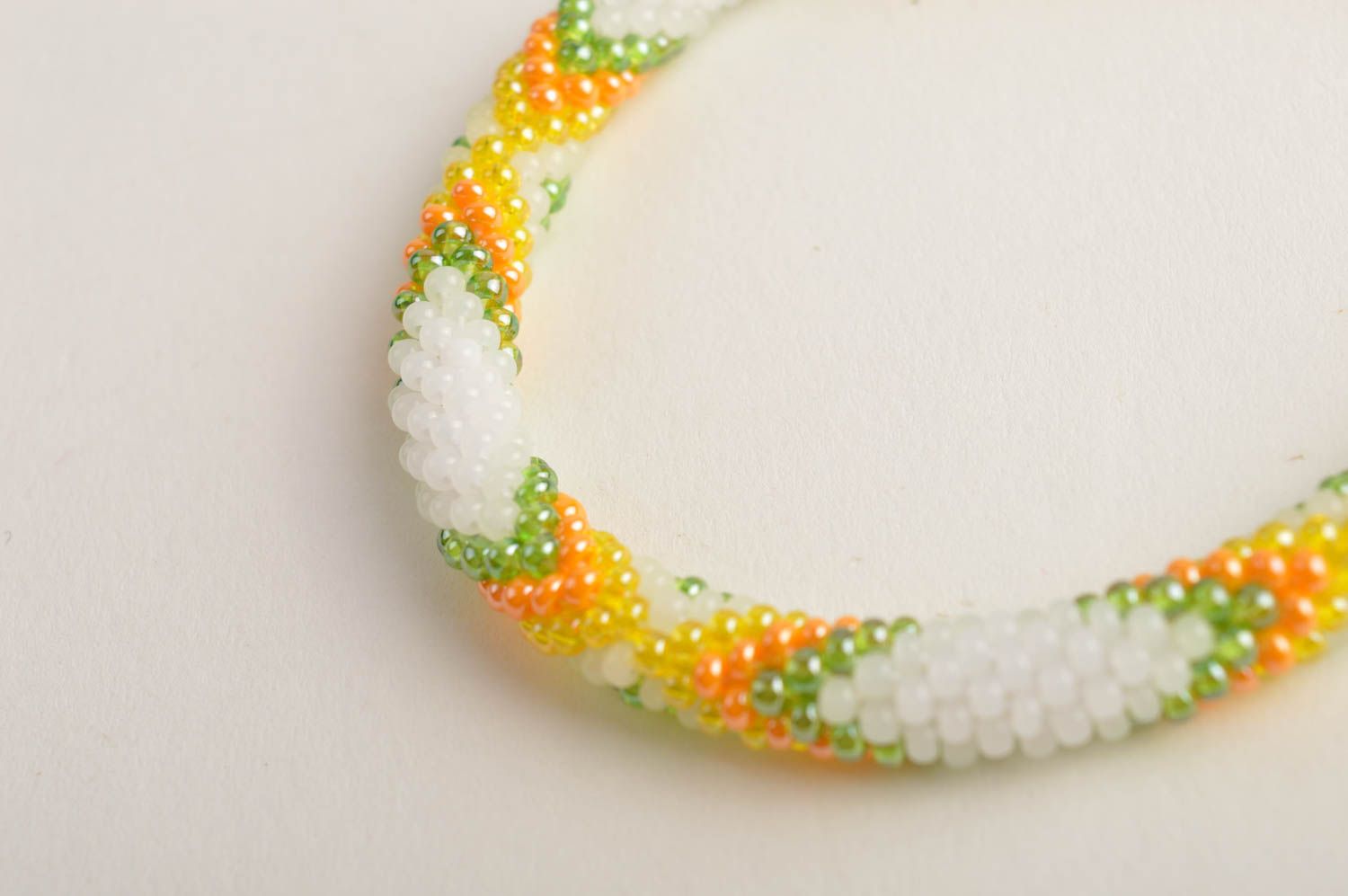Beaded cord adjustable bracelet in light green, yellow and white color photo 4