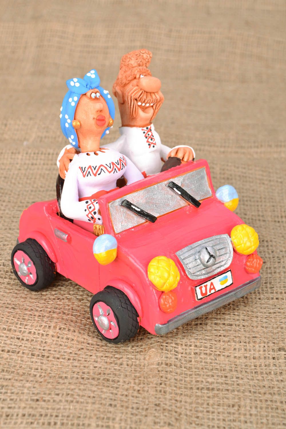 Clay figurine Cossack and his Wife in a Car photo 5