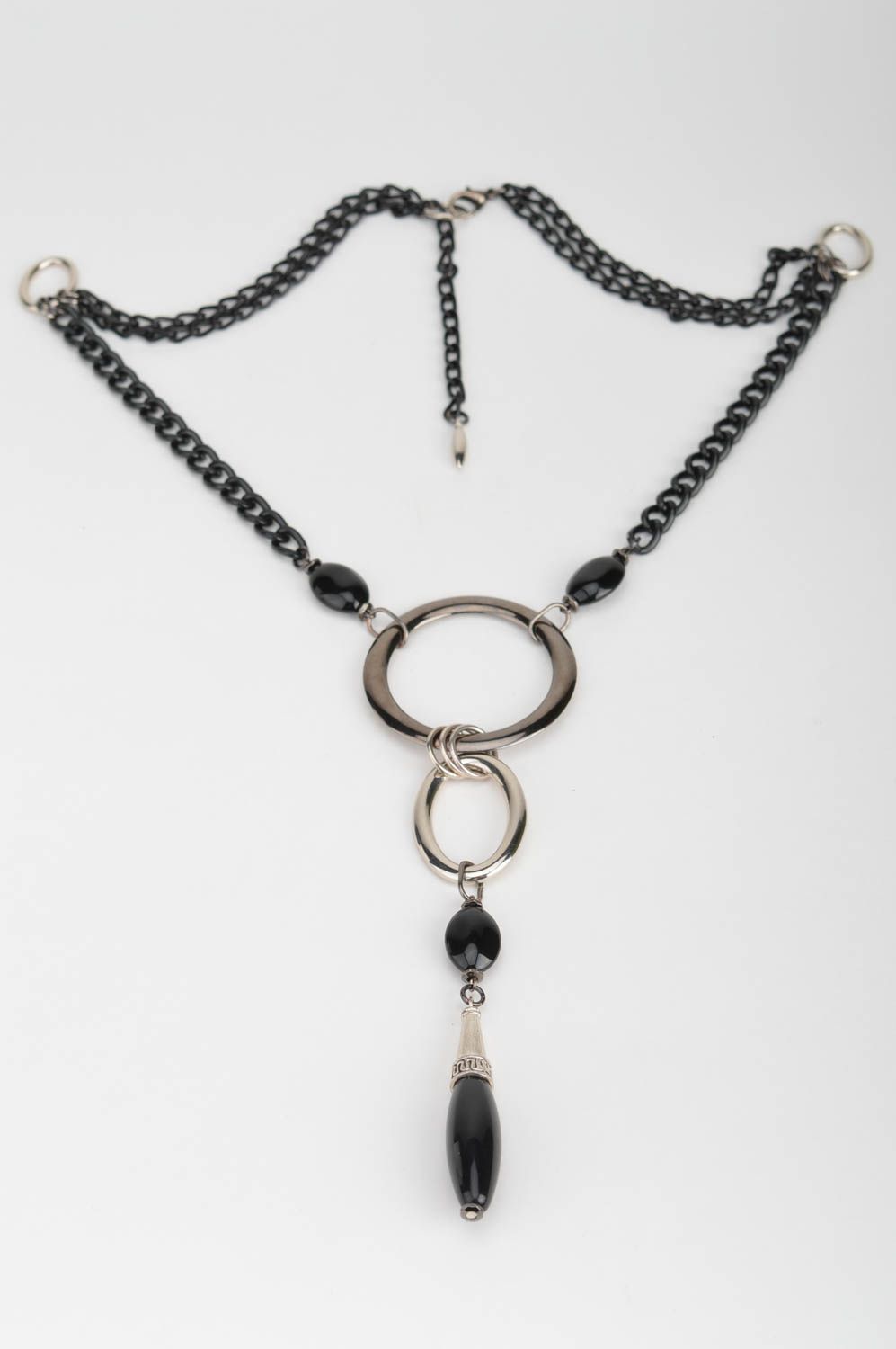 Unusual handmade black and silver colored metal necklace with beads and charm photo 2