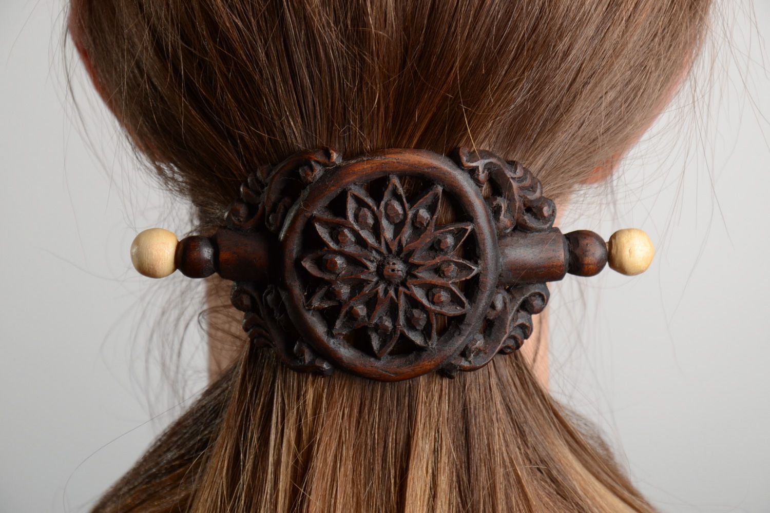 Handmade designer dark tinted wooden hair clip with carved ornament  photo 1