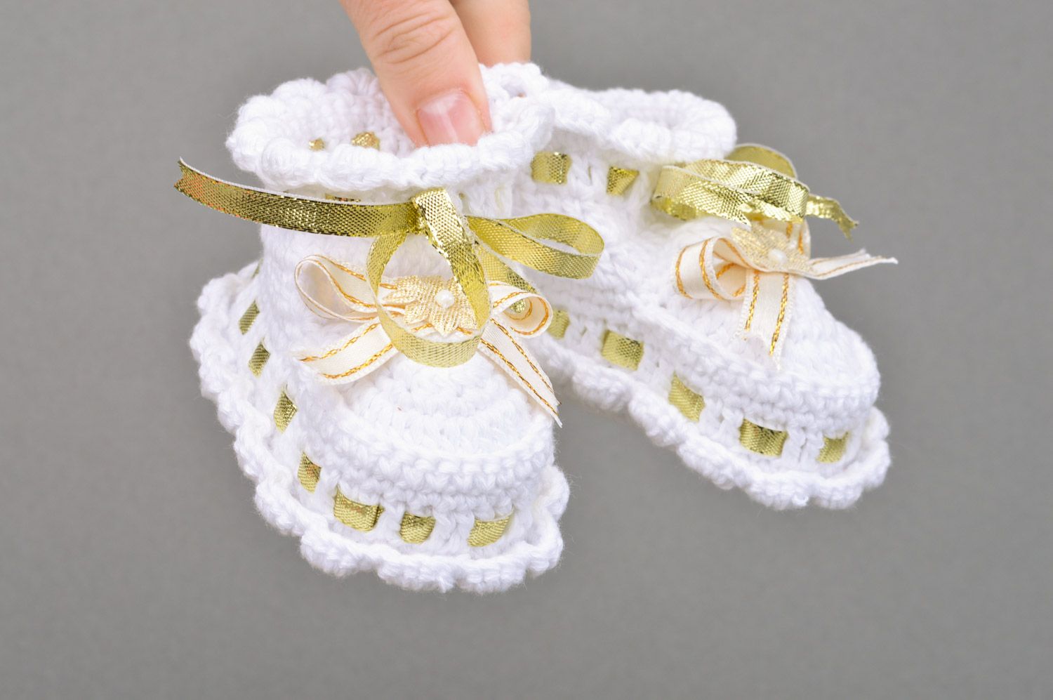 Handmade small summer white baby booties for a girl with golden ribbons photo 3