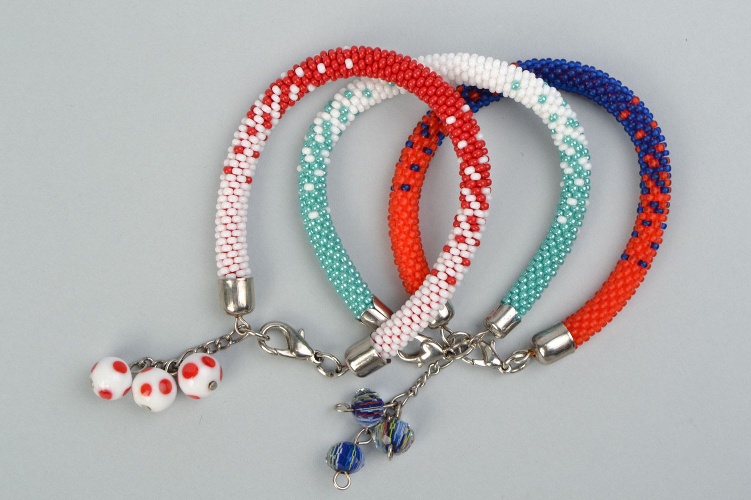 Set of 3 handmade beaded cord bracelets in combinations of white red and blue photo 2