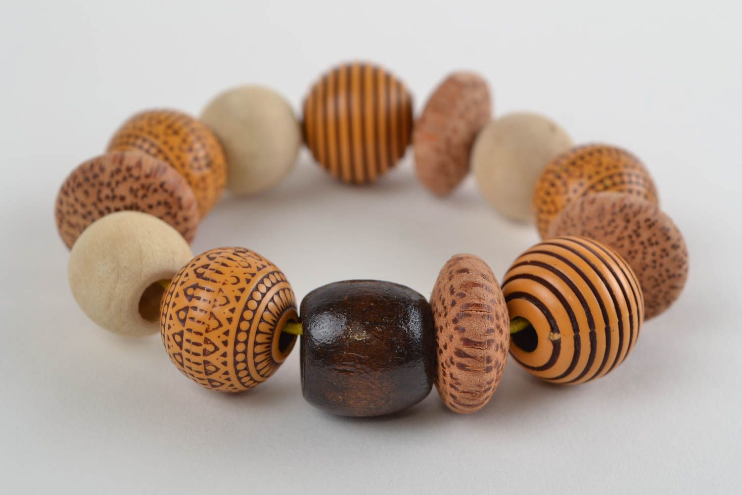 Handmade designer women's wooden and plastic beaded wrist stretch bracelet  photo 1