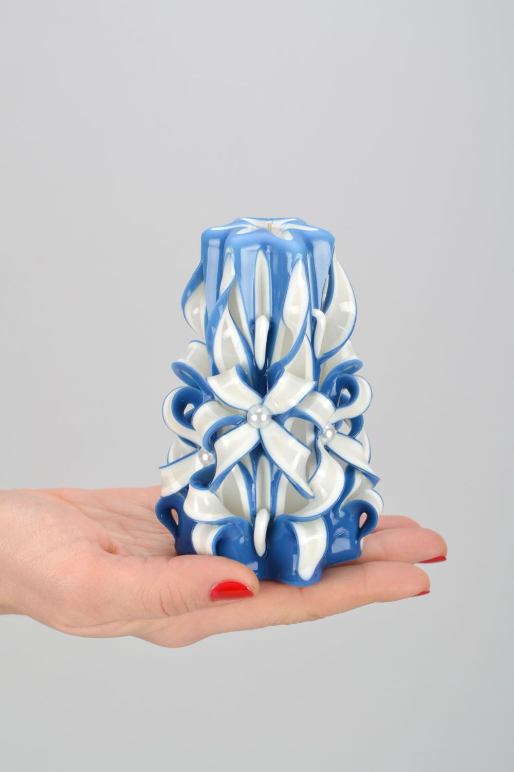 White and blue carved candle photo 2