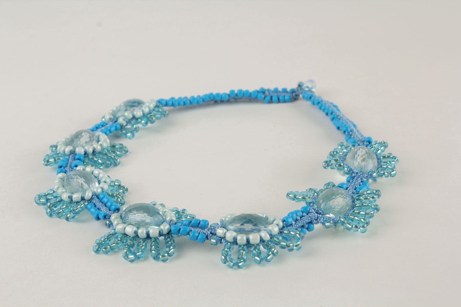 Blue macrame necklace made using the techniques of macrame and ankars photo 4