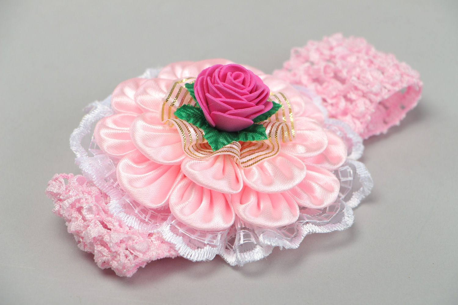 Stylish handmade babies headband with satin ribbons and lace in pink color palette photo 1