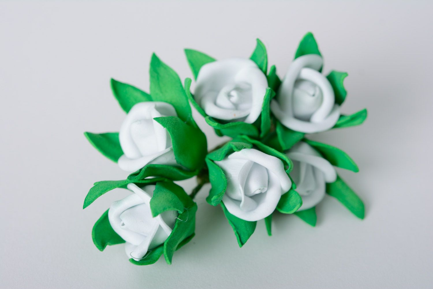 Stylish handmade foamiran fabric flower hair clip of white color with green petals photo 1