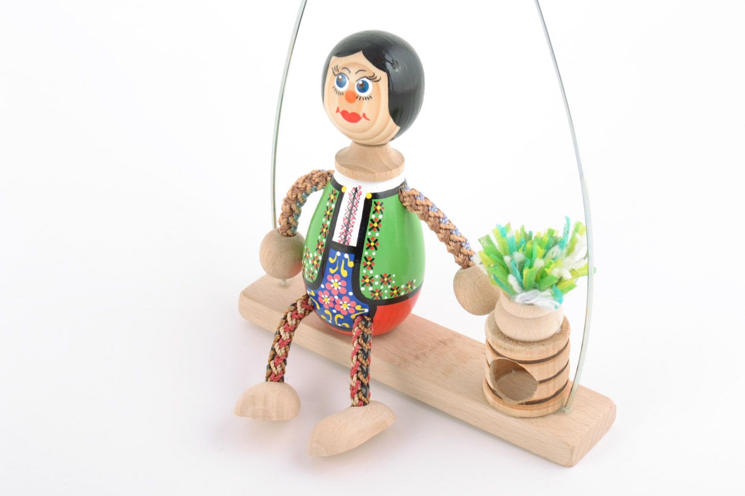 Handmade painted wooden eco toy boy in costume with flower on swing photo 4