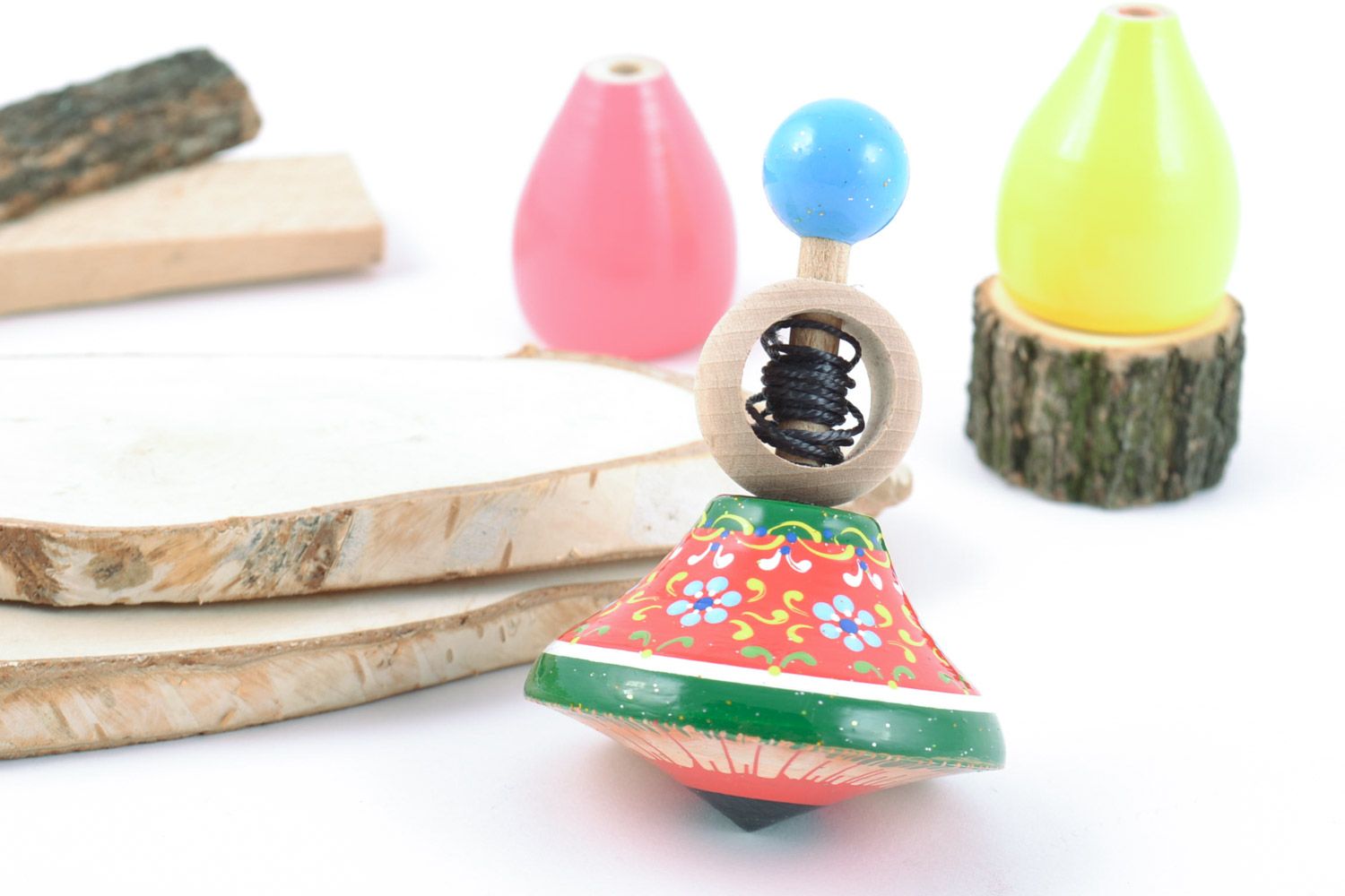 Wooden handmade spinning top decorated with eco-friendly paints  photo 1