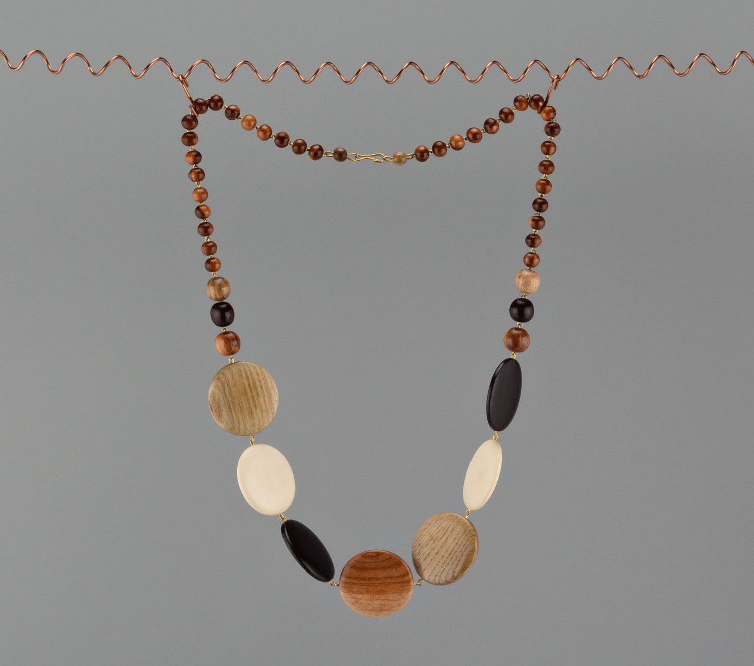 Necklace made of different kinds of wood with a clasp photo 3
