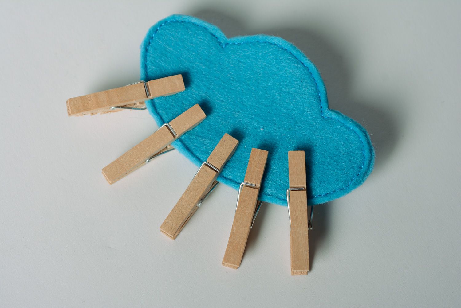 Handmade educational toy of blue color sewn of felt with clothes pins Cloud photo 2