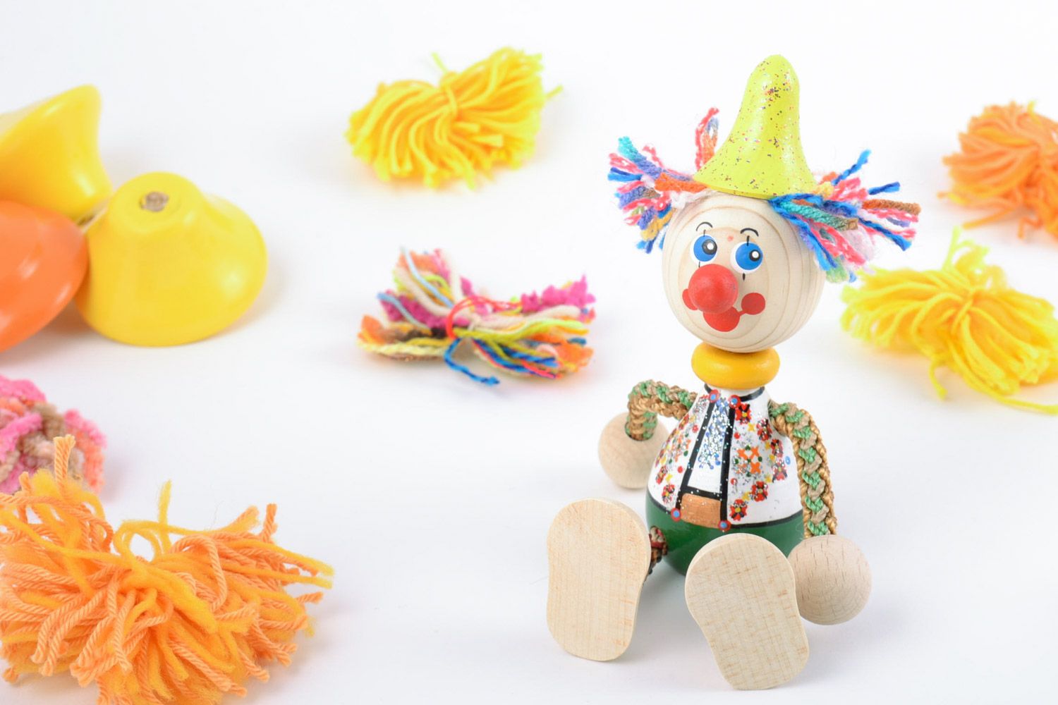 Bright painted homemade wooden eco toy clown with yellow hat for children photo 1