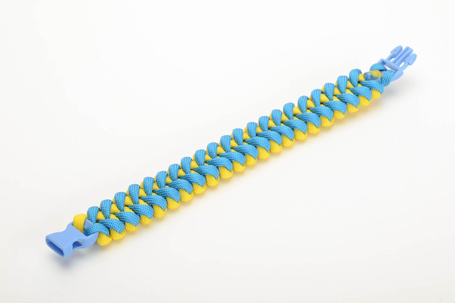 Handmade wrist survival bracelet woven of yellow and blue parachute cords photo 4