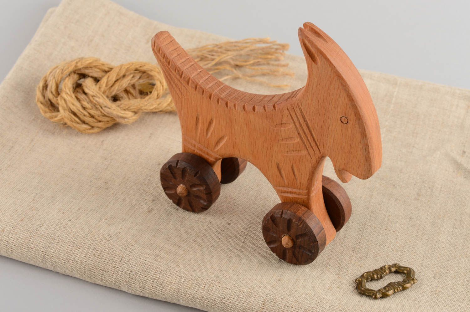 Eco friendly handmade wooden wheeled toy goat for children photo 1