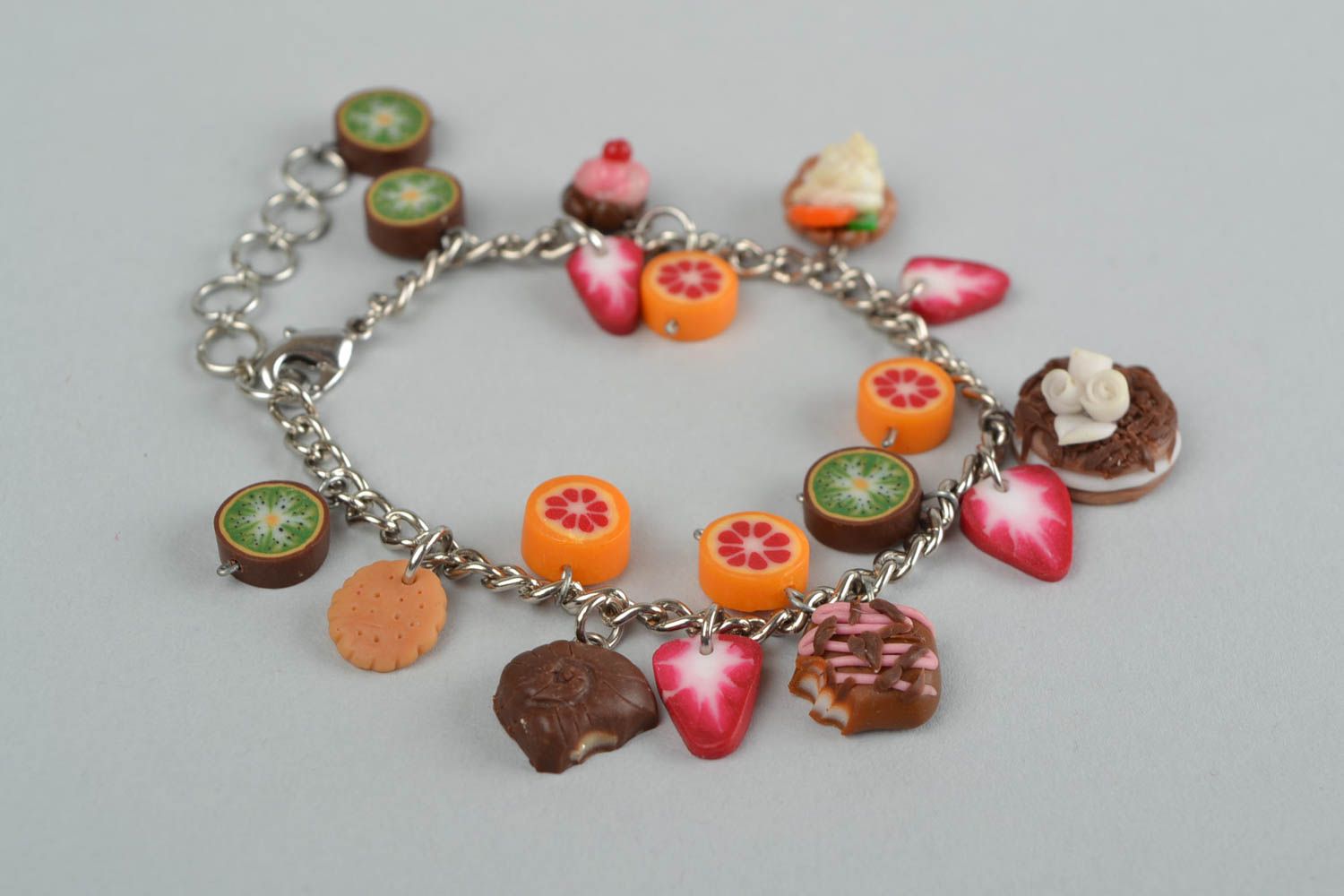 Handmade bracelet made of polymer clay on chain with decorative sweets photo 1