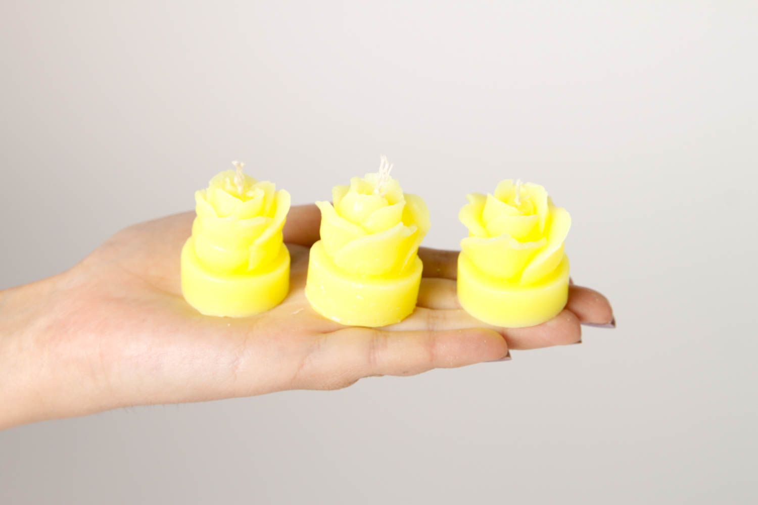 Handmade beautiful candles bright yellow candles 3 cute decor elements photo 2